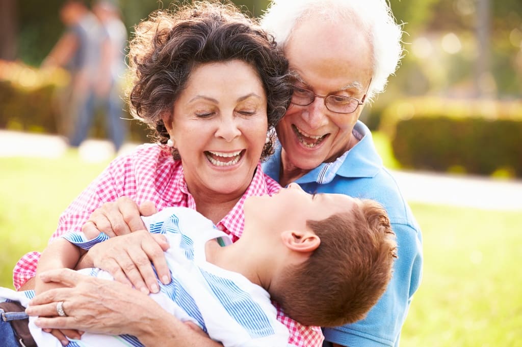 Grandparents Laughing with Their Grandchild